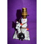 A mid century small ceramic table lamp having kitsch style figure of foal