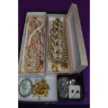 A tray of vintage costume jewellery including Trifari necklace and bracelet, enamelled jewellery