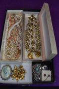 A tray of vintage costume jewellery including Trifari necklace and bracelet, enamelled jewellery