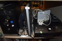 A collection of computer equipment including Dell monitor and scanner/printer.