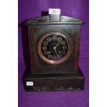 A Victorian gothic mantle clock having slate and marble case with brass and painted face by Mappin