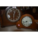 Two vintage wooden mantel clocks, one being Smiths the other an Elliot clock.