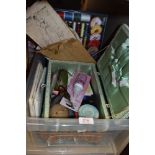 A vintage sewing basket and a collection of Haberdashery and sewing patterns.