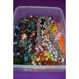 A box of costume jewellery necklaces, mainly of multi strand bead form