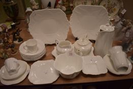 A collection of Shelley dainty white including tea pot,coffee pot,sugar basin and more.