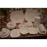 A collection of Shelley dainty white including tea pot,coffee pot,sugar basin and more.
