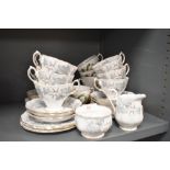 A selection of tea cups and saucers by Aynsley and Crown Royal