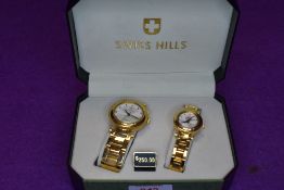 A cased Swiss Hills His & Hers watch set