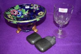 A Maling ware rose bowl having floral pattern on blue ground,also included is a hipflask and glass.