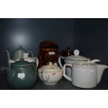 A selection of vintage and retro tea and coffee pots including Woods ware Beryl and a novelty dog