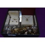 A small selection of costume jewellery including fashion watches, two cased diamante necklaces,