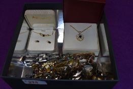 A small selection of costume jewellery including fashion watches, two cased diamante necklaces,