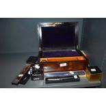 A mahogany cased writers set having turtle shell banding and selection of stationary