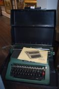 A Silver Reed 500 typewriter in case.