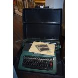 A Silver Reed 500 typewriter in case.