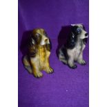 Two cocker spaniel figurines.