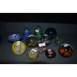 A selection of art glass paper weights and glass mushroom including Caithness and Selkirk