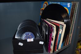 A selection of vinyl records and 7inch pop singles including soul and disco interest