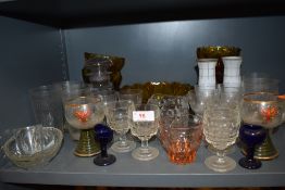 A selection of glass ware including two blue eye baths, and etched drinking glasses.