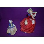 Two Royal Doulton figurines, Dinky Do HN1678 and Autumn Breezes HN1934