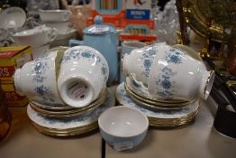 A selection of teacups and saucers by Colclough in the Braganza design