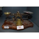 A set of antique chemist or apothecary scales with accompanying weight set
