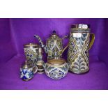 A selection of Doulton Lambeth table wares havine HM silver rims and fitments including water jug