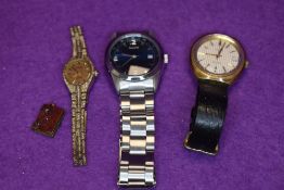 Two gents wrist watches, a ladies wrist watch and a royal souvenir charm