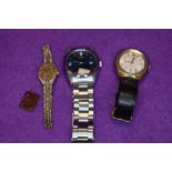 Two gents wrist watches, a ladies wrist watch and a royal souvenir charm