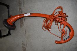 An electric garden strimmer