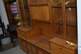 A mid century design wall unit by Nathan having glazed display shelving 190cm long