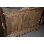 A 19th Century stripped pine panelled bedding box