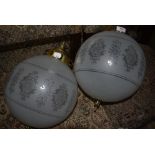 A pair of etched glass globe light fittings having brass gallery