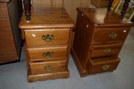 A pair of modern pine bedside drawer chests