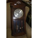 An early 20th Century mahogany cased wall clock