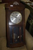 An early 20th Century mahogany cased wall clock