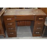 An early 20th Century stained frame dressing table having internal mirror on underside of central