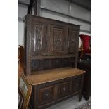 A late 19th century converted oak Kist base having similar dresser back with carved panel doors