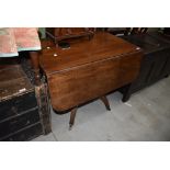 An antique mahogany fold out tea or breakfast table having one under drawer and one false