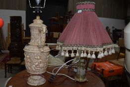 Two classical reproduction lamps one chalk ware and similar brass and onyx style