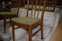 A set of four vintage fork back dining chairs