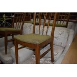 A set of four vintage fork back dining chairs