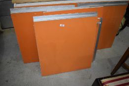 A selection of vintage kitchen cabinet doors in orange