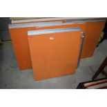 A selection of vintage kitchen cabinet doors in orange