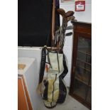 A selection of hickory golf clubs, Stamped Moffat and a long bow shaft etc