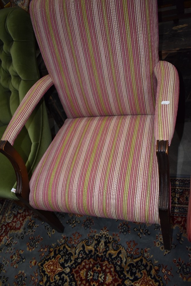 A carver dining room chair with mahogany frame and corduroy seat
