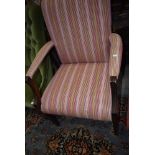 A carver dining room chair with mahogany frame and corduroy seat