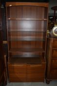 A vintage laminate teak effect wall unit, width 84cm