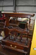 A side table magazine rack in mahogany having under drawer