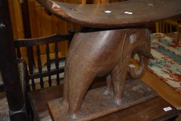 A traditional tribal art carved elephant stool